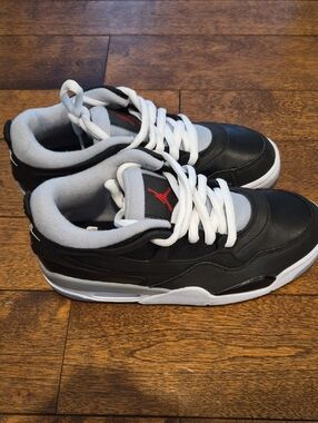 Nike Air Jordan 4 Low-Top Sneakers in Black, White & Red